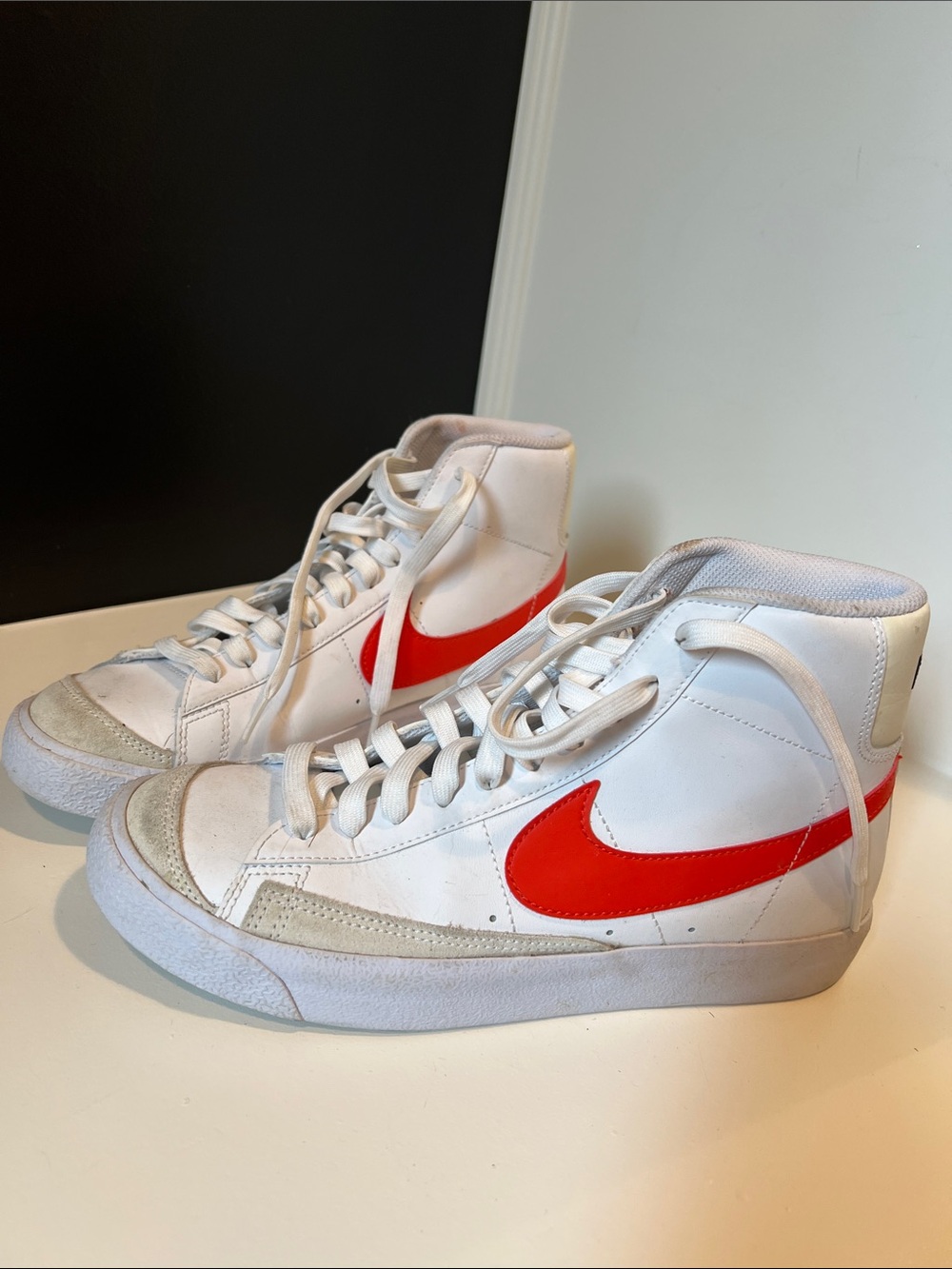 Nike White High-Top Sneakers with Red Swoosh
